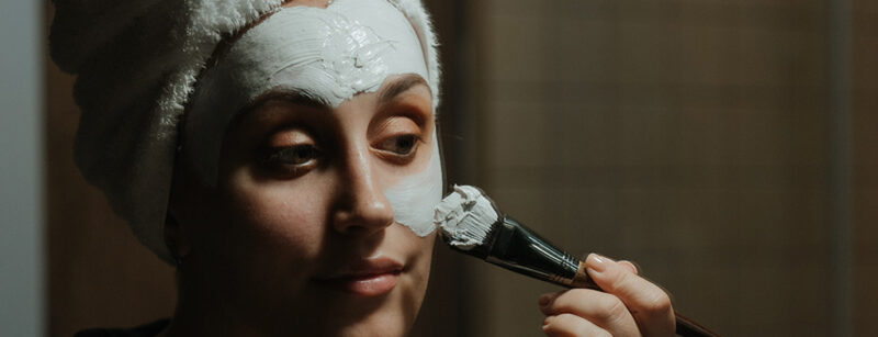 image of person applying face mask